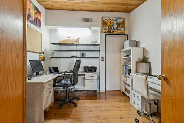 a view of workspace with wooden floor