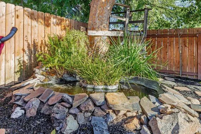 a backyard of a house with outdoor seating