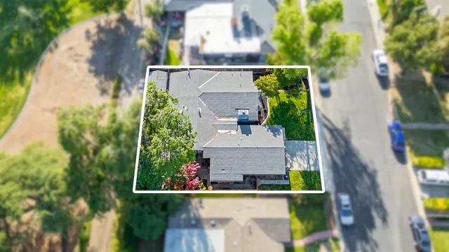 an aerial view of house with yard