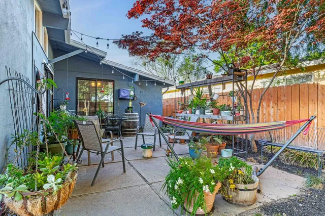 a view of a chairs and table in a patio