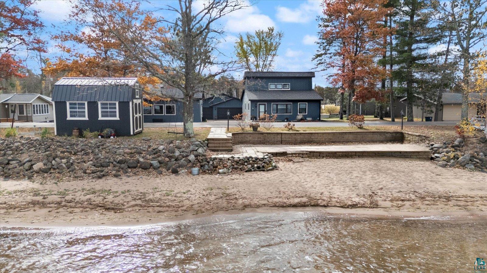 36318 Lakeland Road Sturgeon Lake, MN 55783 - Photo 1 of 23 Back of house featuring a gambrel roof and a metal roof