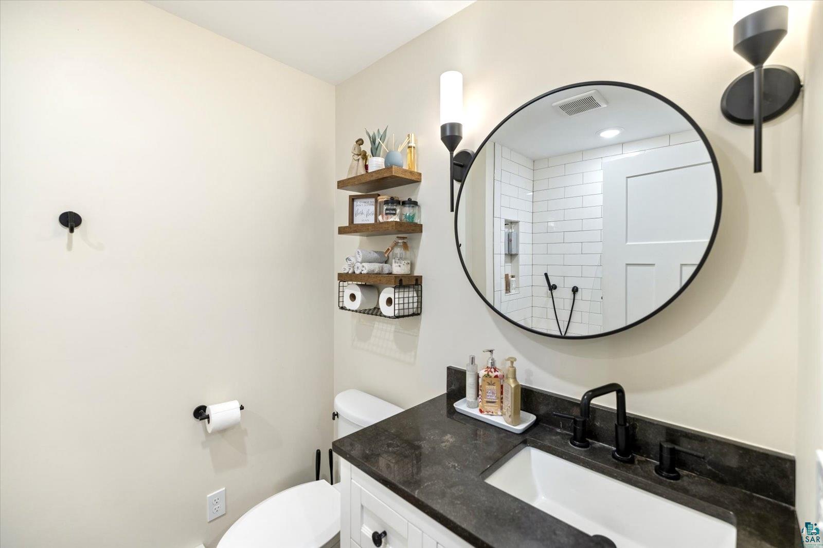 36318 Lakeland Road Sturgeon Lake, MN 55783 - Photo 13 of 23 Bathroom with vanity and tiled shower