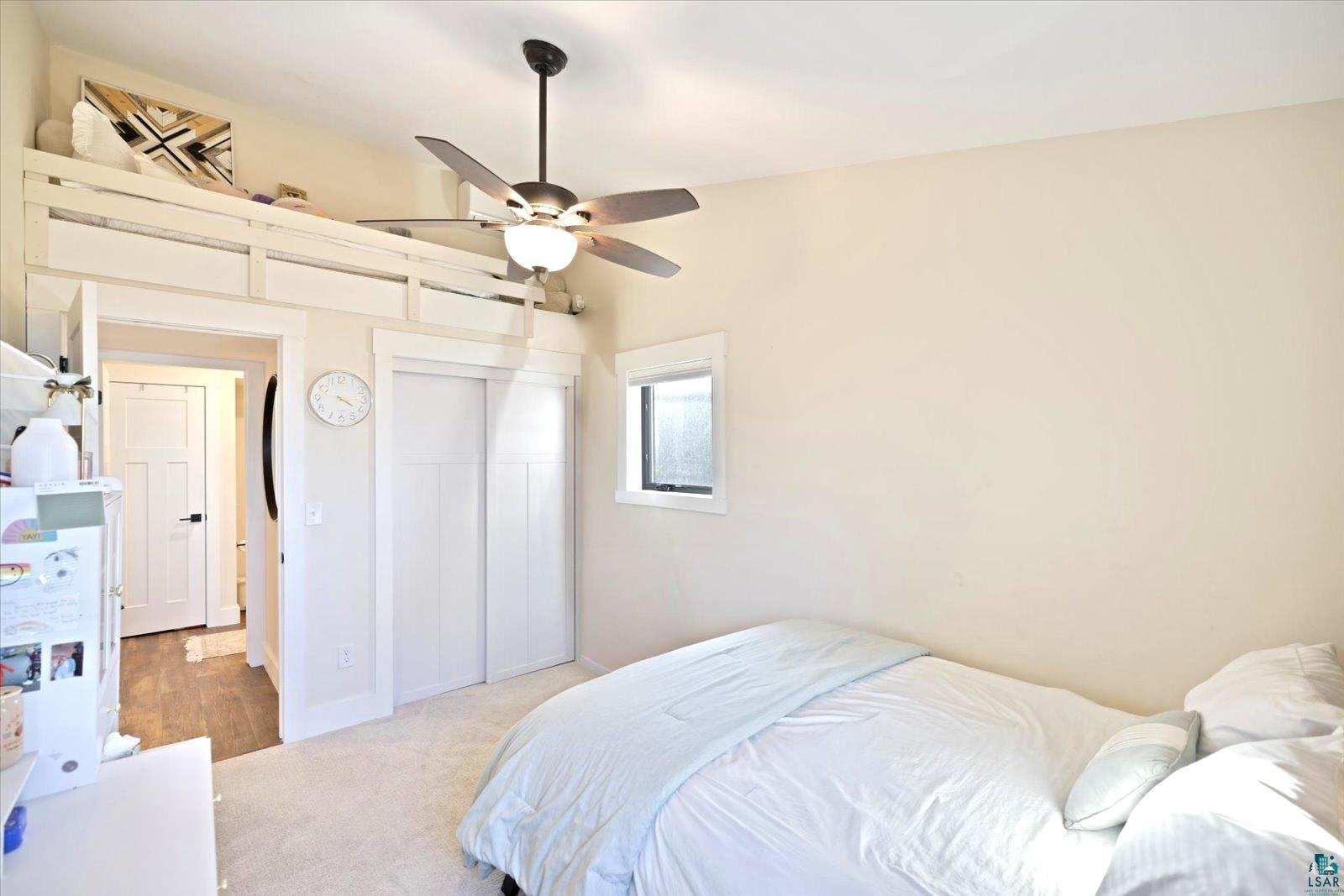 36318 Lakeland Road Sturgeon Lake, MN 55783 - Photo 14 of 23 Carpeted bedroom with ceiling fan and a closet