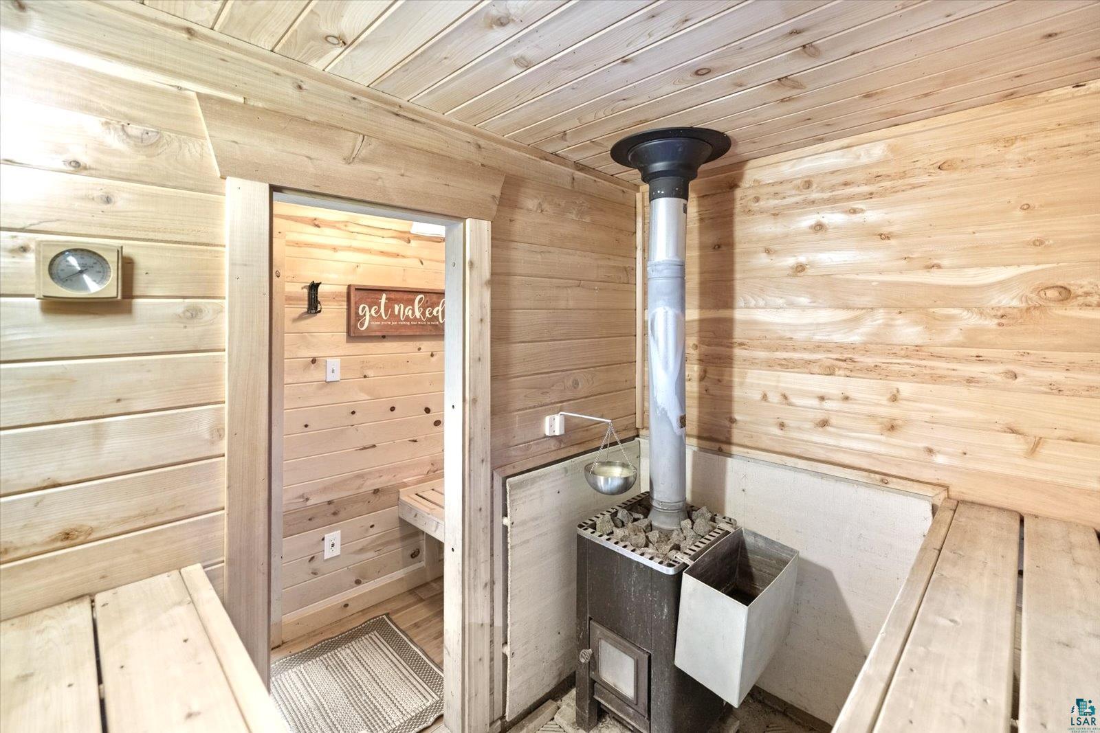 36318 Lakeland Road Sturgeon Lake, MN 55783 - Photo 20 of 23 Relaxing sauna / steam room with wood ceiling and wooden walls