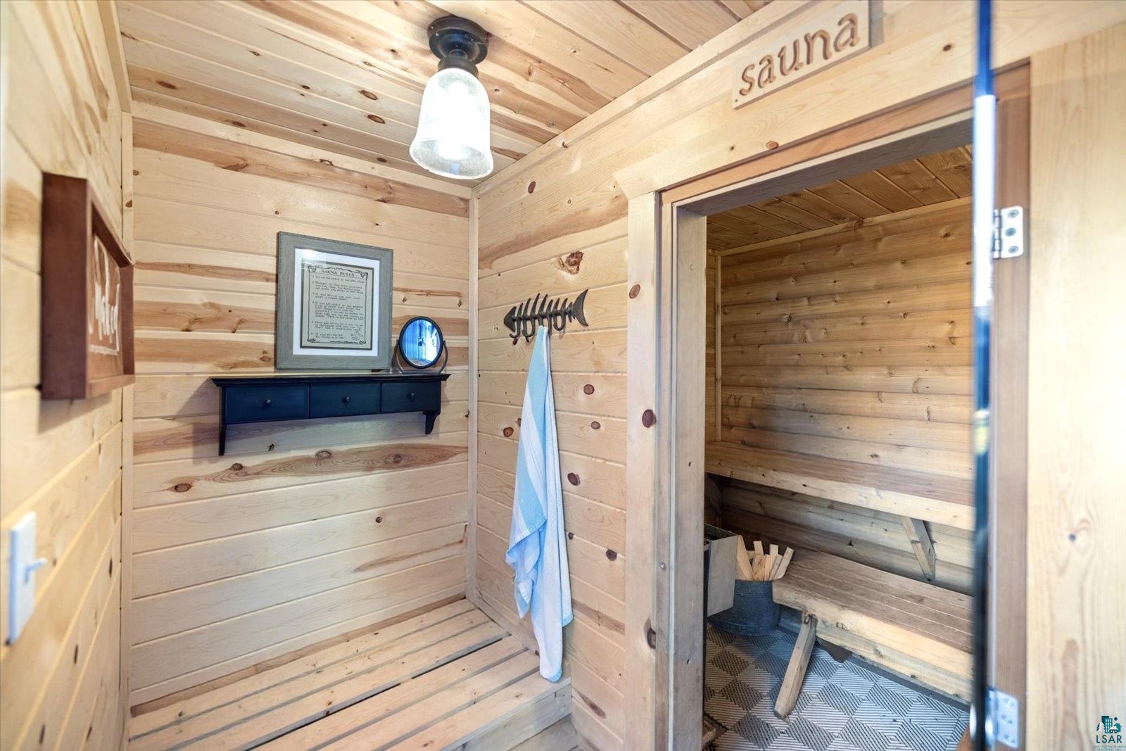 36318 Lakeland Road Sturgeon Lake, MN 55783 - Photo 21 of 23 Relaxing sauna with wood walls and wood ceiling