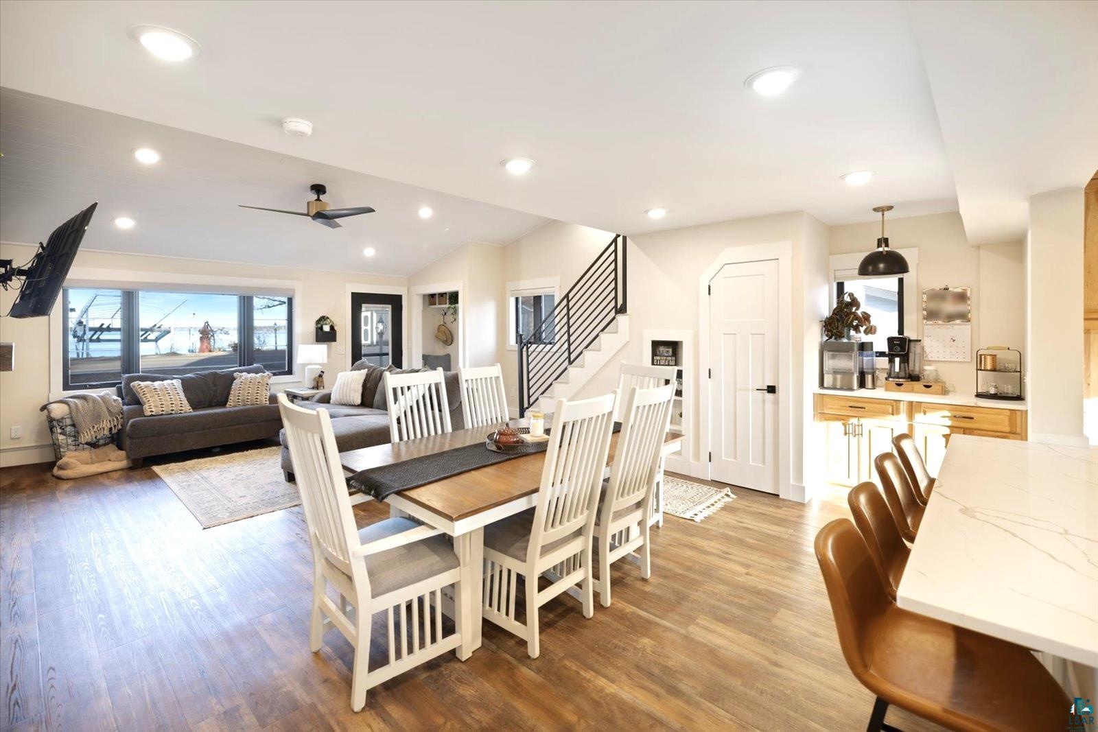 36318 Lakeland Road Sturgeon Lake, MN 55783 - Photo 6 of 23 Dining room featuring stairway, light wood-style floors, recessed lighting, vaulted ceiling, and ceiling fan