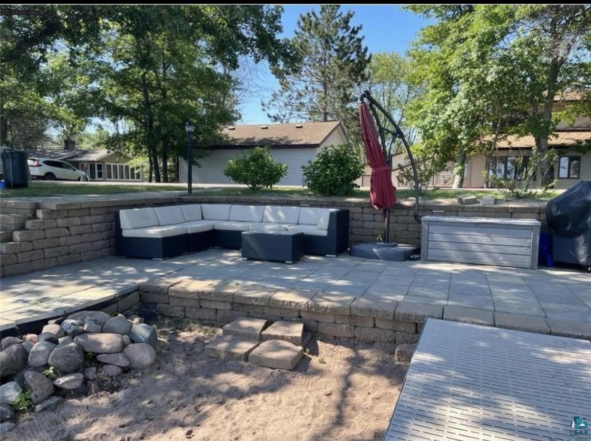 36318 Lakeland Road Sturgeon Lake, MN 55783 - Photo 10 of 23 View of patio with outdoor lounge area and a grill