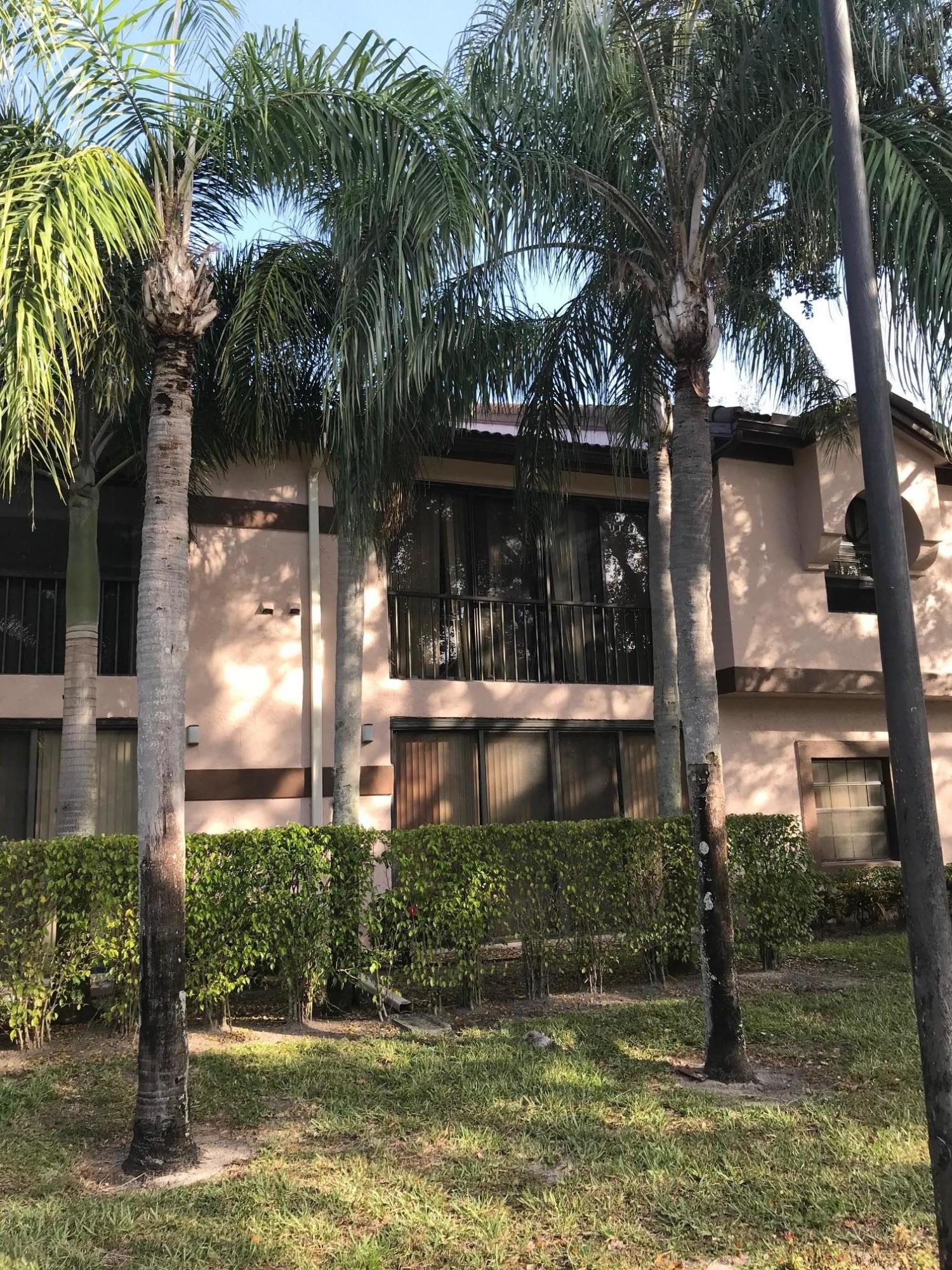a front view of a house with yard