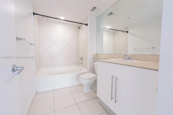 a view of a storage and utility room with washer and dryer
