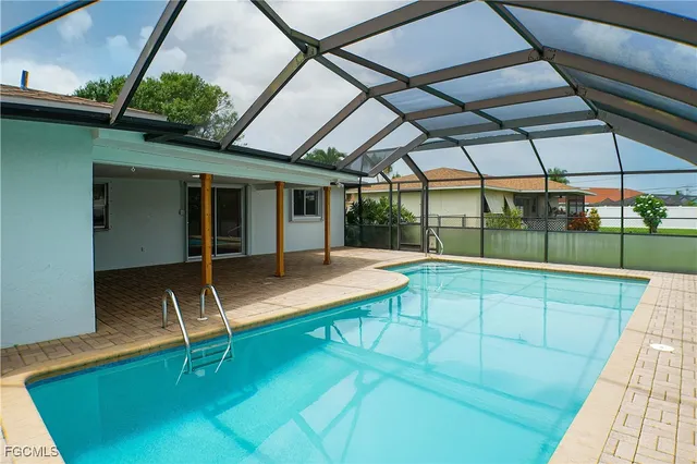 a view of a backyard with a patio and a garden