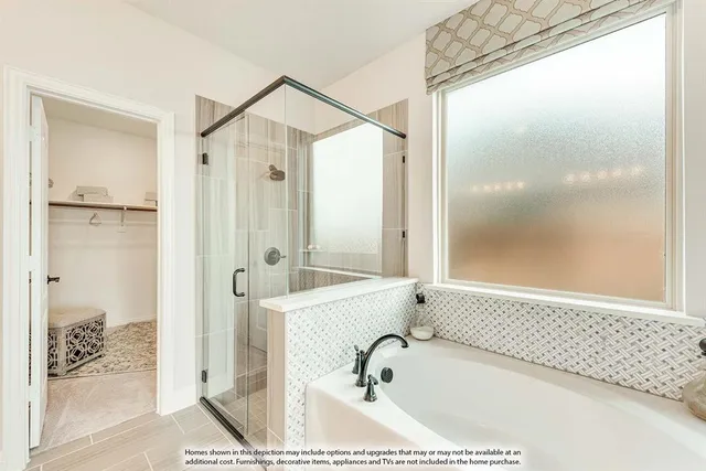 a bathroom with a tub shower and sink