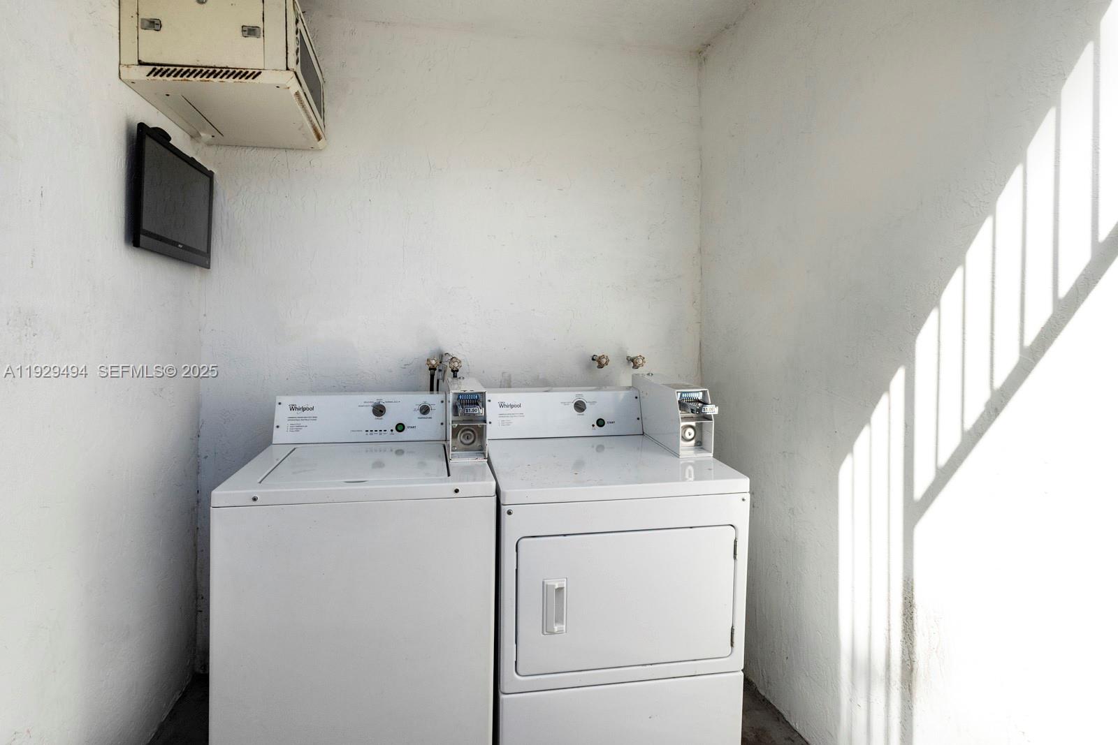 37 Northwest 59th Street, Unit 1 Miami, FL 33127 - Photo 11 of 13 a utility room with dryer and washer
