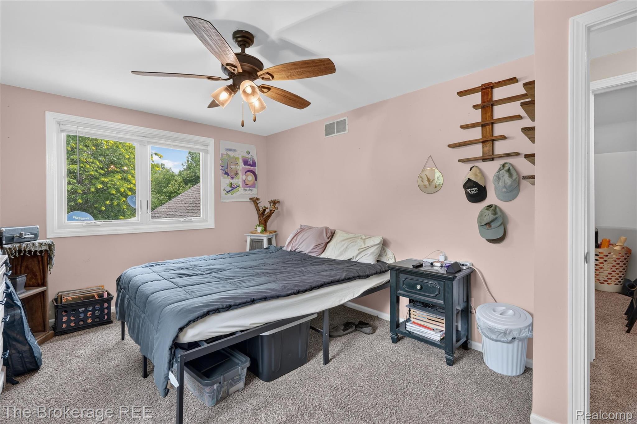 13269 North Genesee Road Clio, MI 48420 - Photo 23 of 67 Bedroom featuring neutral-toned carpet, a ceiling fan with integrated lighting, and a window with white trim