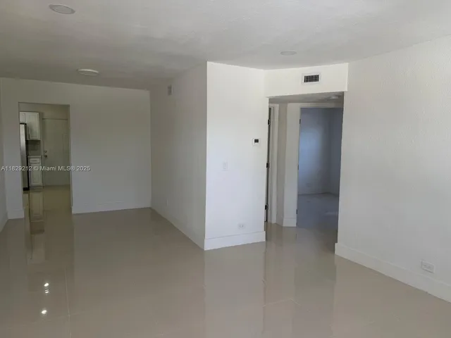 an empty room with entrance door