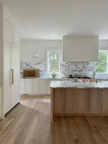 a kitchen with granite countertop a sink and cabinets