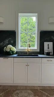 a bathroom with a sink and a window