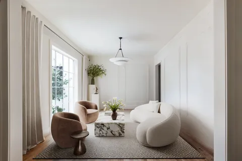 a living room with furniture and window