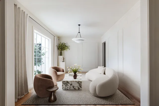 a living room with furniture and window