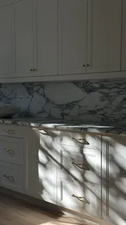 a view of cabinets and wooden floor