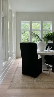 a living room with furniture window and a table