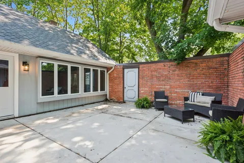 a backyard of a house with seating space