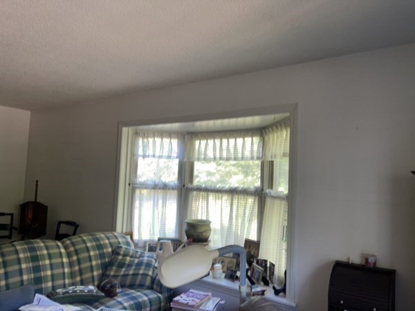 33 Castlegate Drive, Unit B Springfield, MA 01129 - Photo 15 of 18 a living room with furniture and a floor to ceiling window