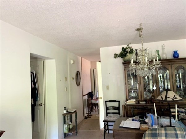 33 Castlegate Drive, Unit B Springfield, MA 01129 - Photo 9 of 18 a view of a dining room with furniture and chandelier