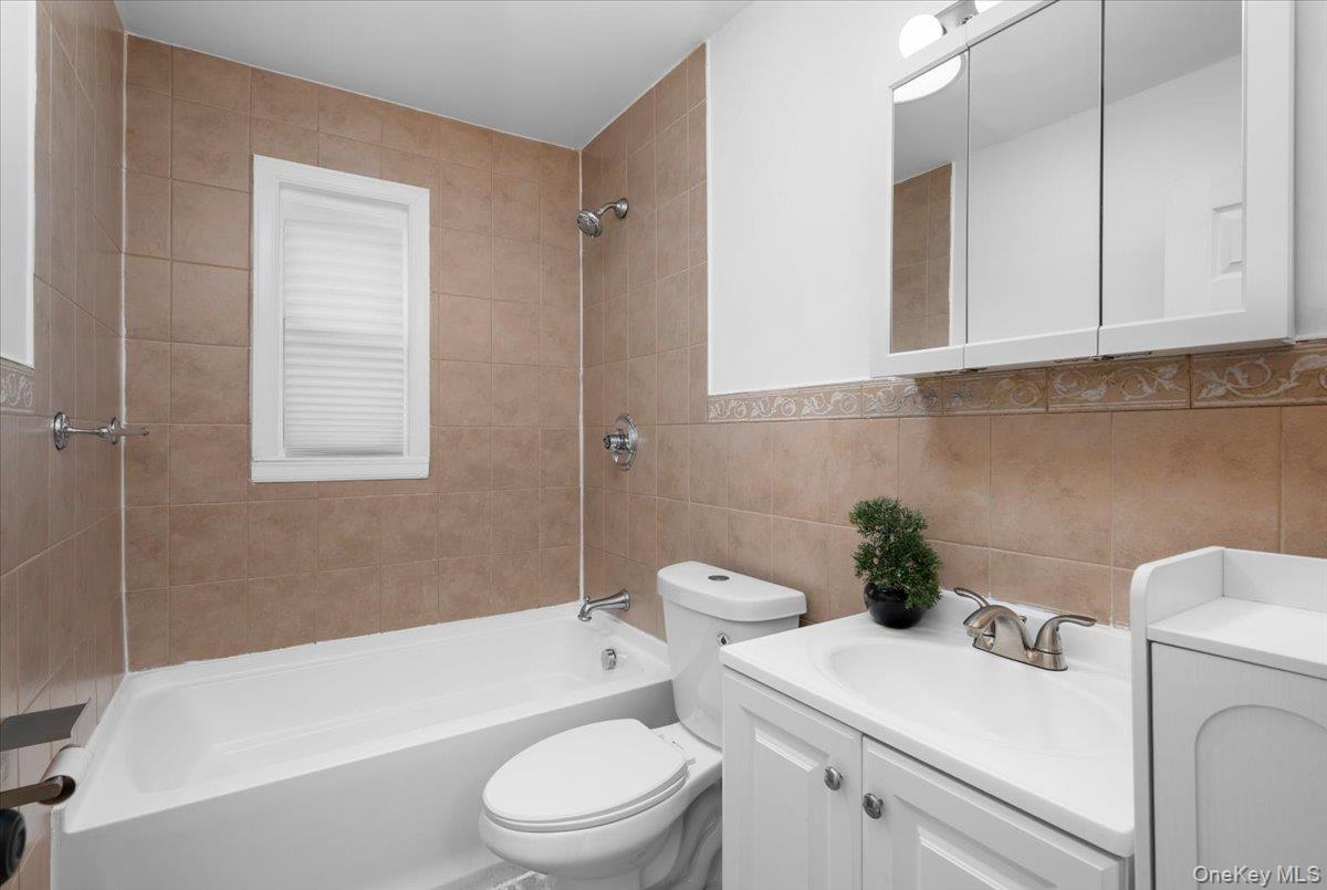 179-49 Zoller Road Queens, NY 11434 - Photo 12 of 21 a bathroom with a sink a toilet and bathtub