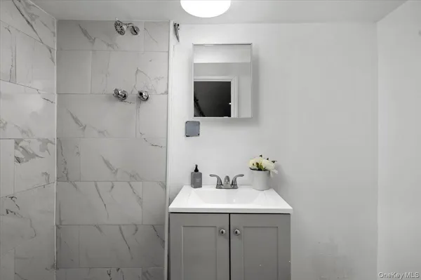 a bathroom with a sink and mirror