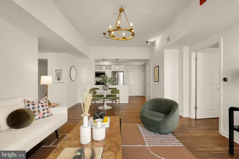 a living room with furniture and a table