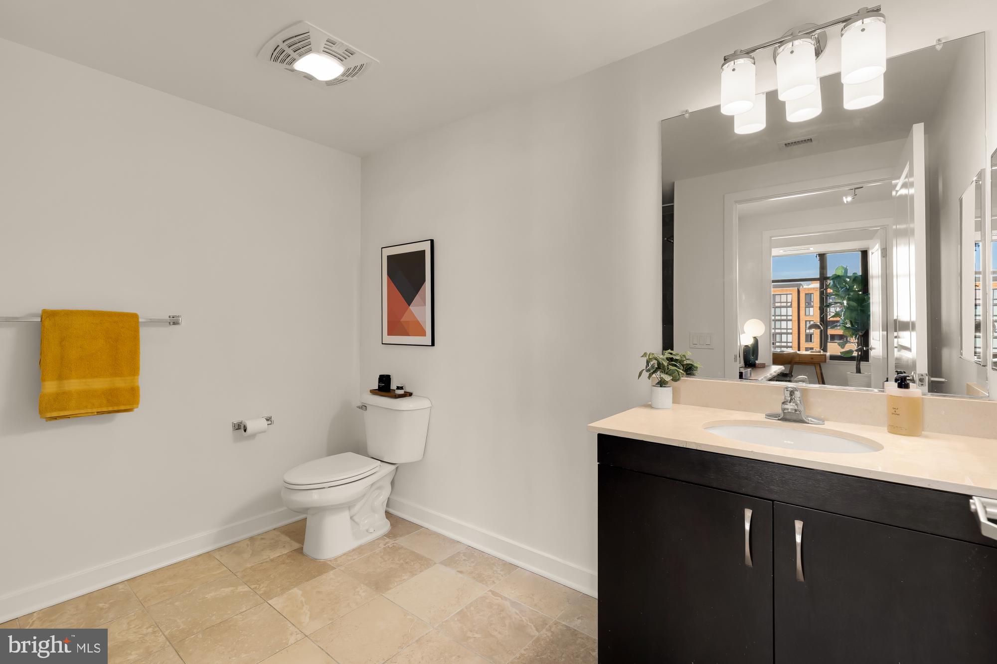 475 K Street Northwest, Unit 1126 Washington, DC 20001 - Photo 24 of 51 a bathroom with a sink toilet and a mirror