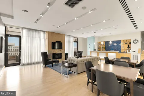 a living room with fireplace furniture and a flat screen tv