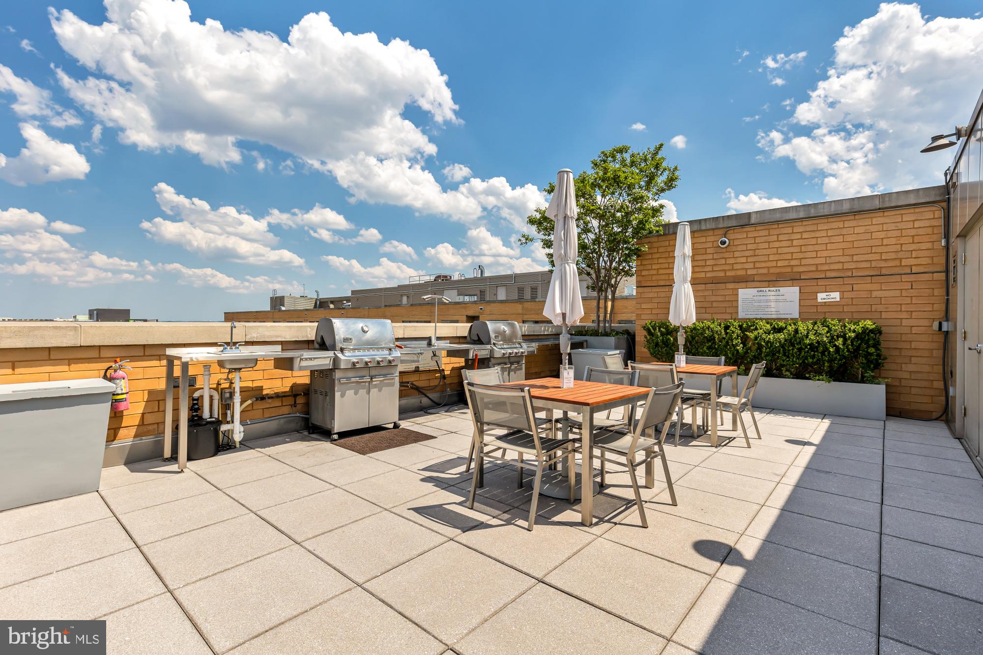 475 K Street Northwest, Unit 1126 Washington, DC 20001 - Photo 36 of 51 a view of a patio with dining table and chairs