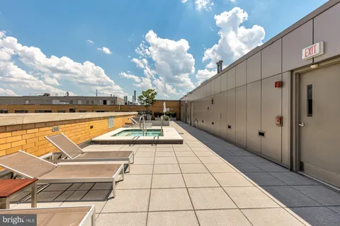 a view of swimming pool with seating space