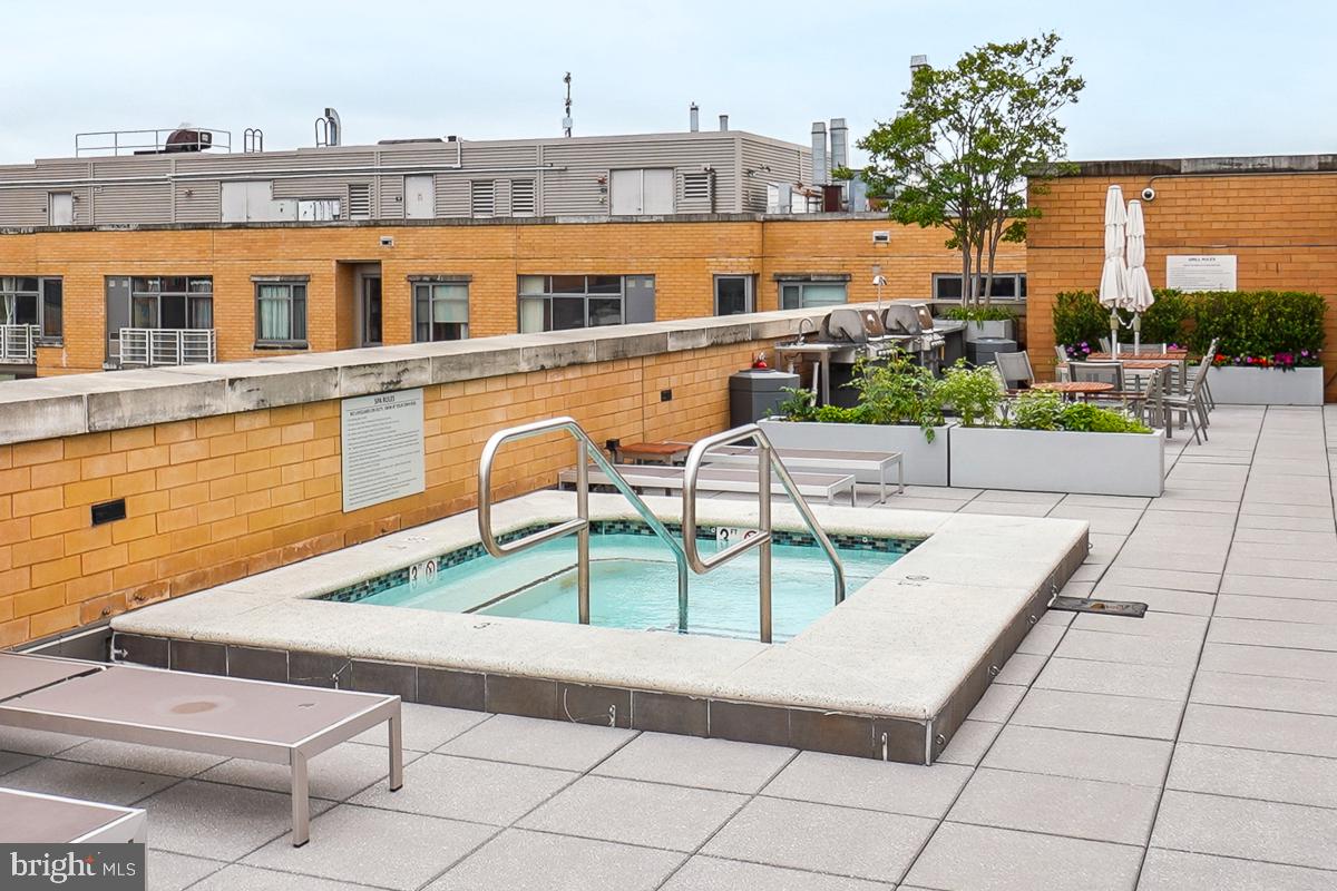 475 K Street Northwest, Unit 1126 Washington, DC 20001 - Photo 40 of 51 a view of a swimming pool with a lounge chairs