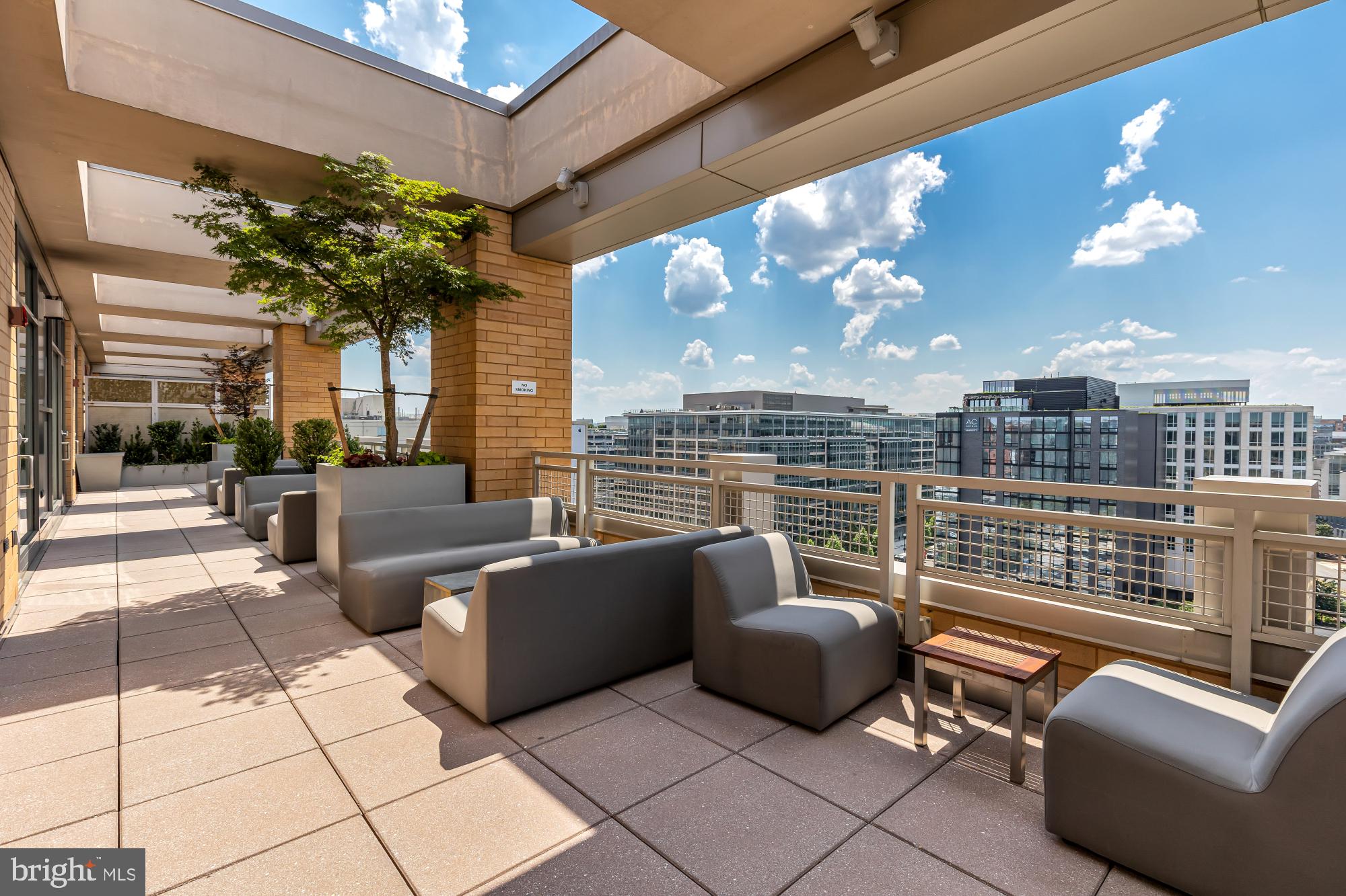 475 K Street Northwest, Unit 1126 Washington, DC 20001 - Photo 41 of 51 a balcony with furniture and a potted plant