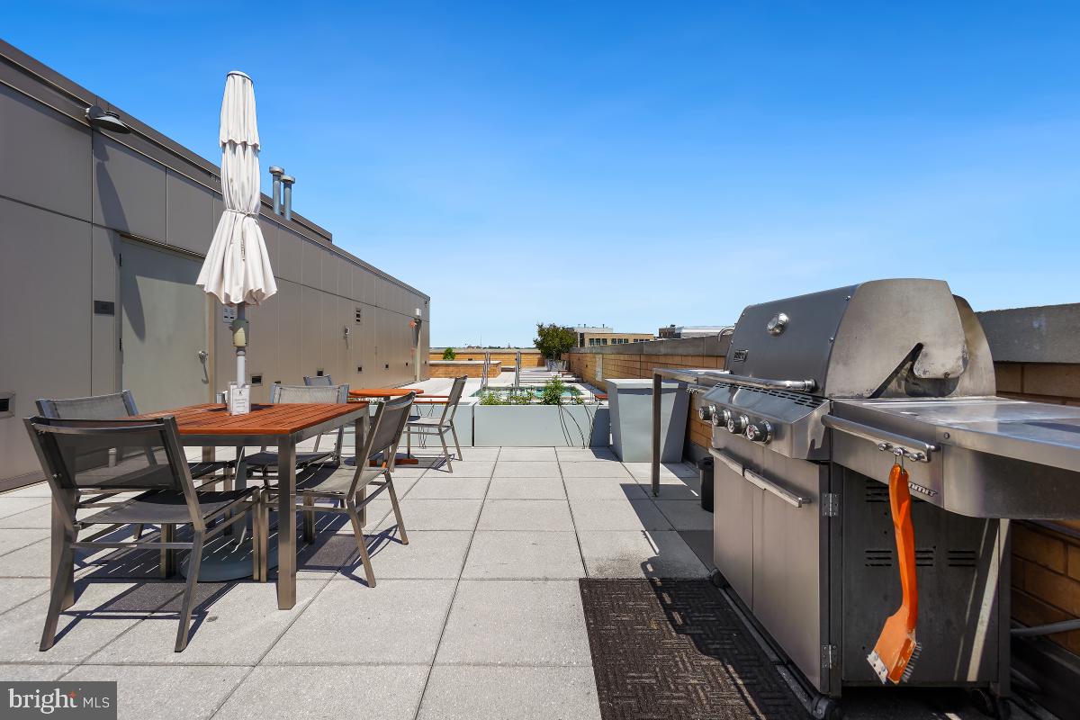 475 K Street Northwest, Unit 1126 Washington, DC 20001 - Photo 43 of 51 a view of a patio with table and chairs