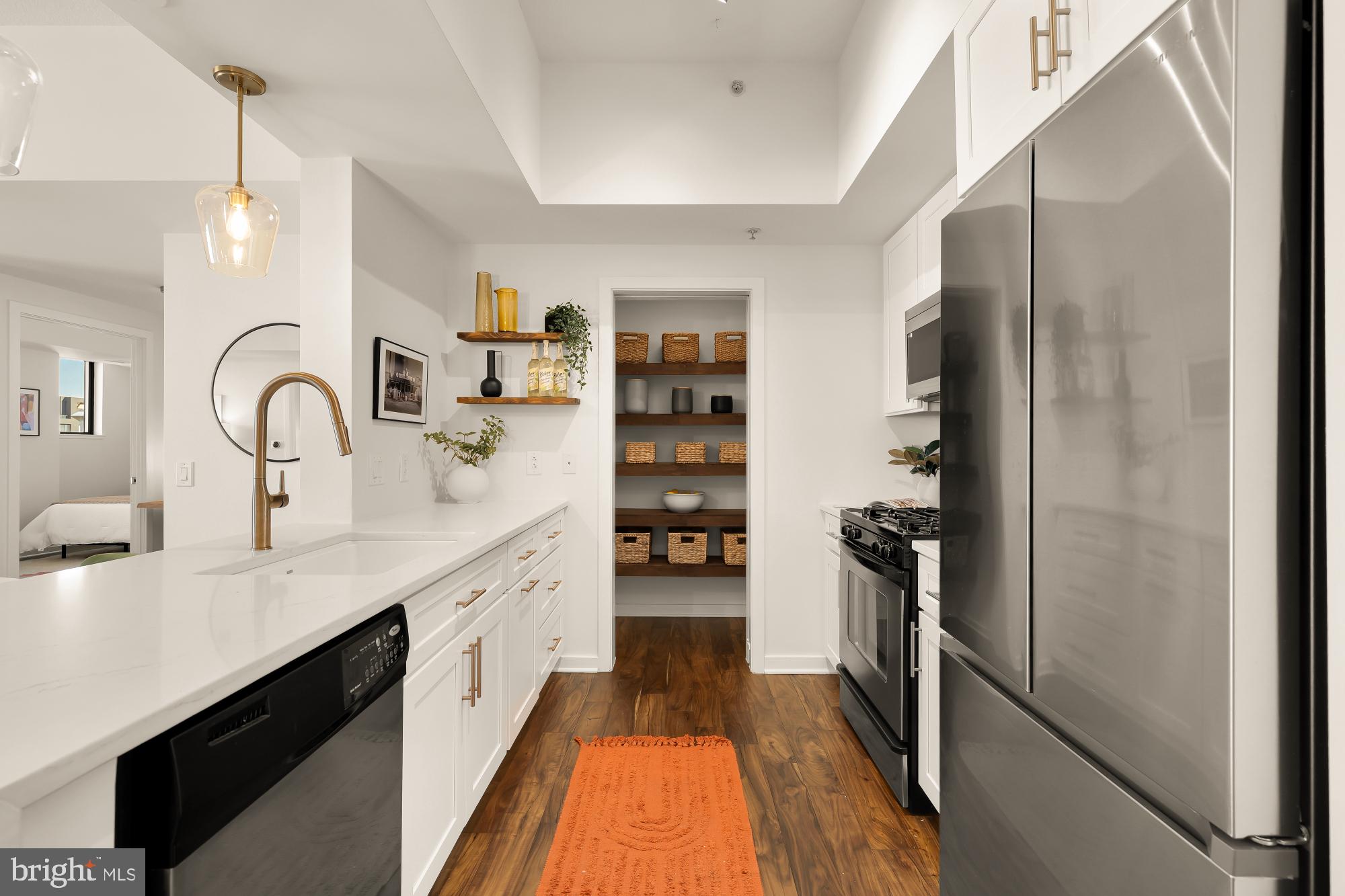 475 K Street Northwest, Unit 1126 Washington, DC 20001 - Photo 7 of 51 a large kitchen with a sink and refrigerator