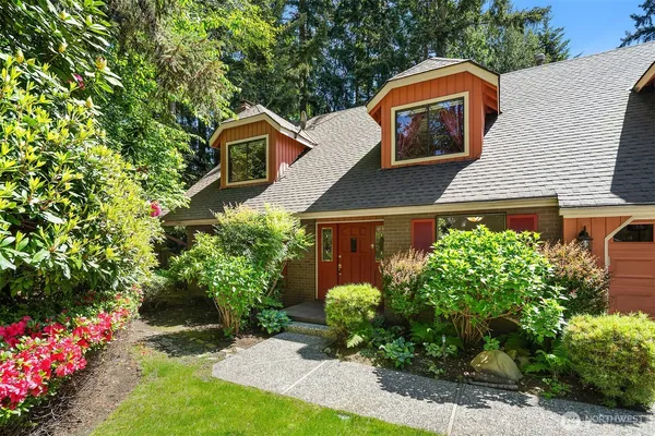 a front view of house with garden