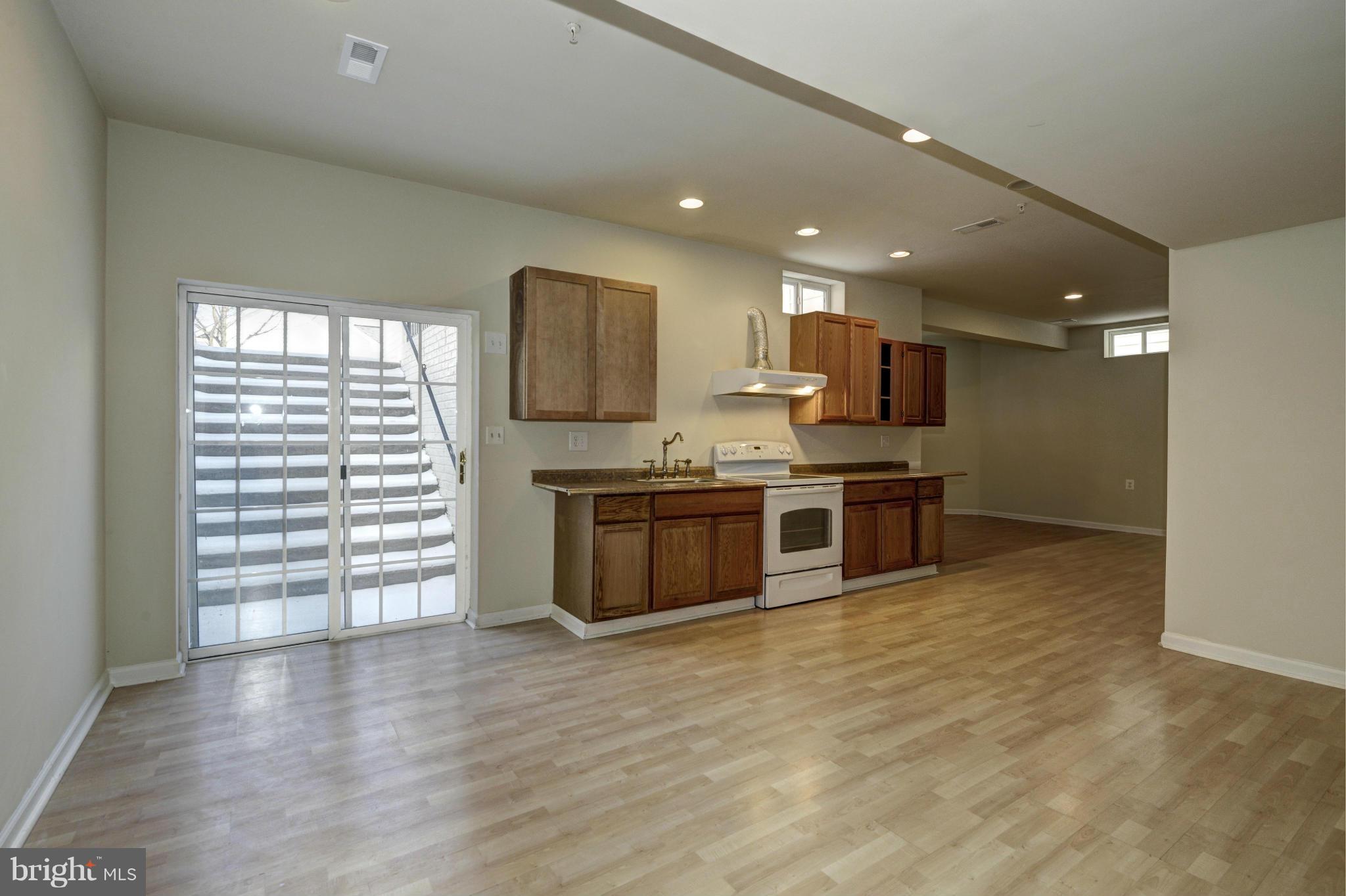 23203 Frederick Road Clarksburg, MD 20871 - Photo 23 of 26 Lower Level Walk- out / Kitchen