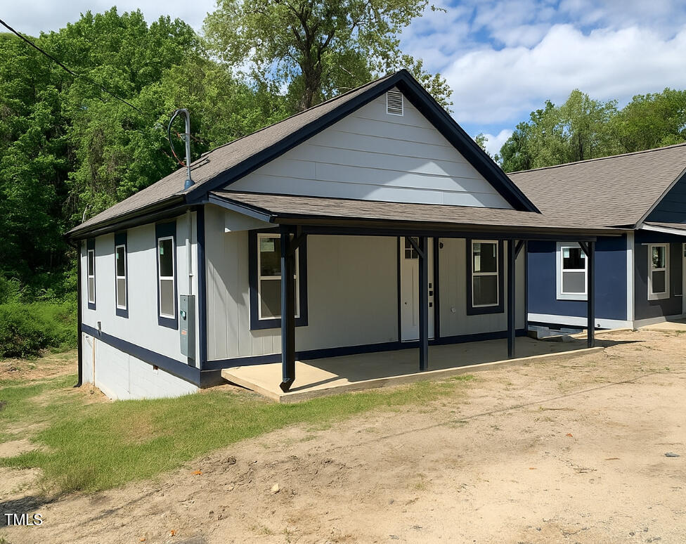 a house with trees in the background