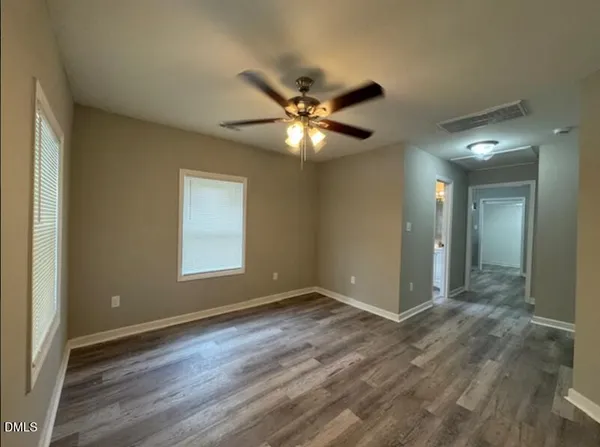 a view of an empty room with a window