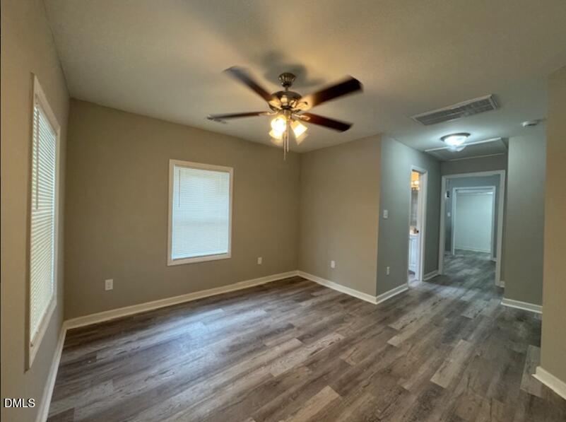 403 Spring Court Henderson, NC 27536 - Photo 3 of 7 a view of an empty room with a window