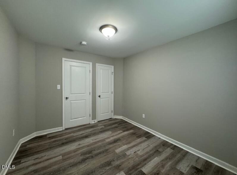 403 Spring Court Henderson, NC 27536 - Photo 5 of 7 a view of room with window and hardwood floor
