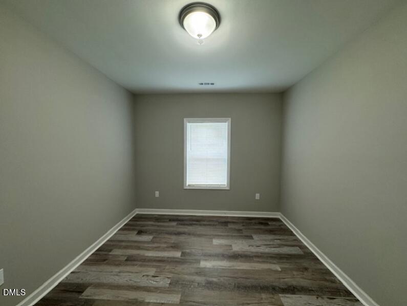 403 Spring Court Henderson, NC 27536 - Photo 6 of 7 an empty room with a window