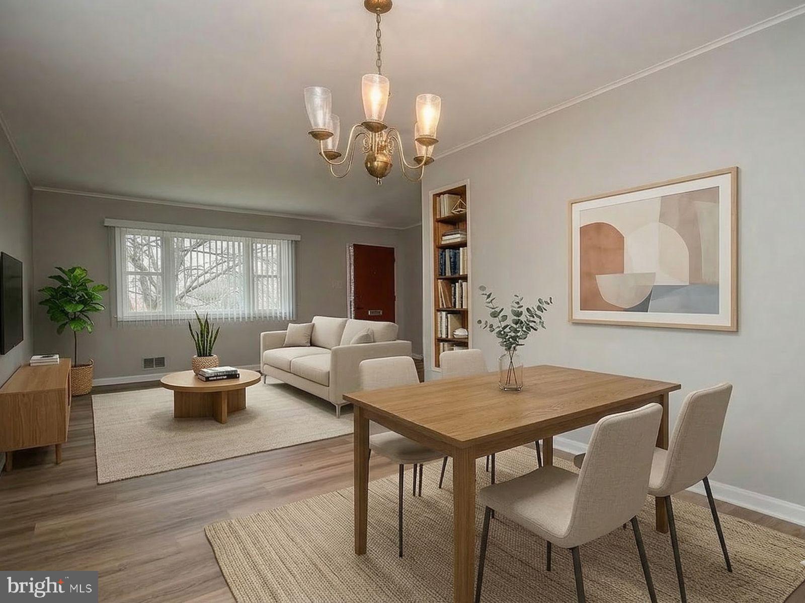 Open living and dining area (virtually staged).