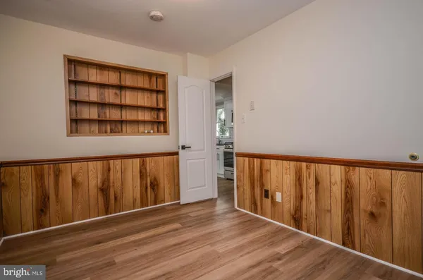 a view of a room with wooden walls