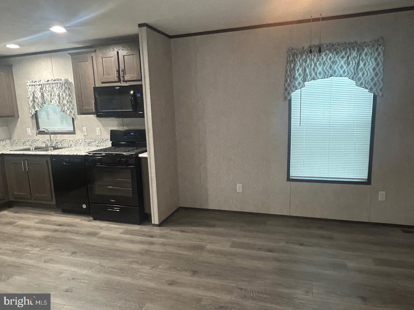 2501 Tilton Road, Unit 323 Egg Harbor Township, NJ 08234 - Photo 3 of 9 a view of kitchen with stainless steel appliances granite countertop a stove and a refrigerator