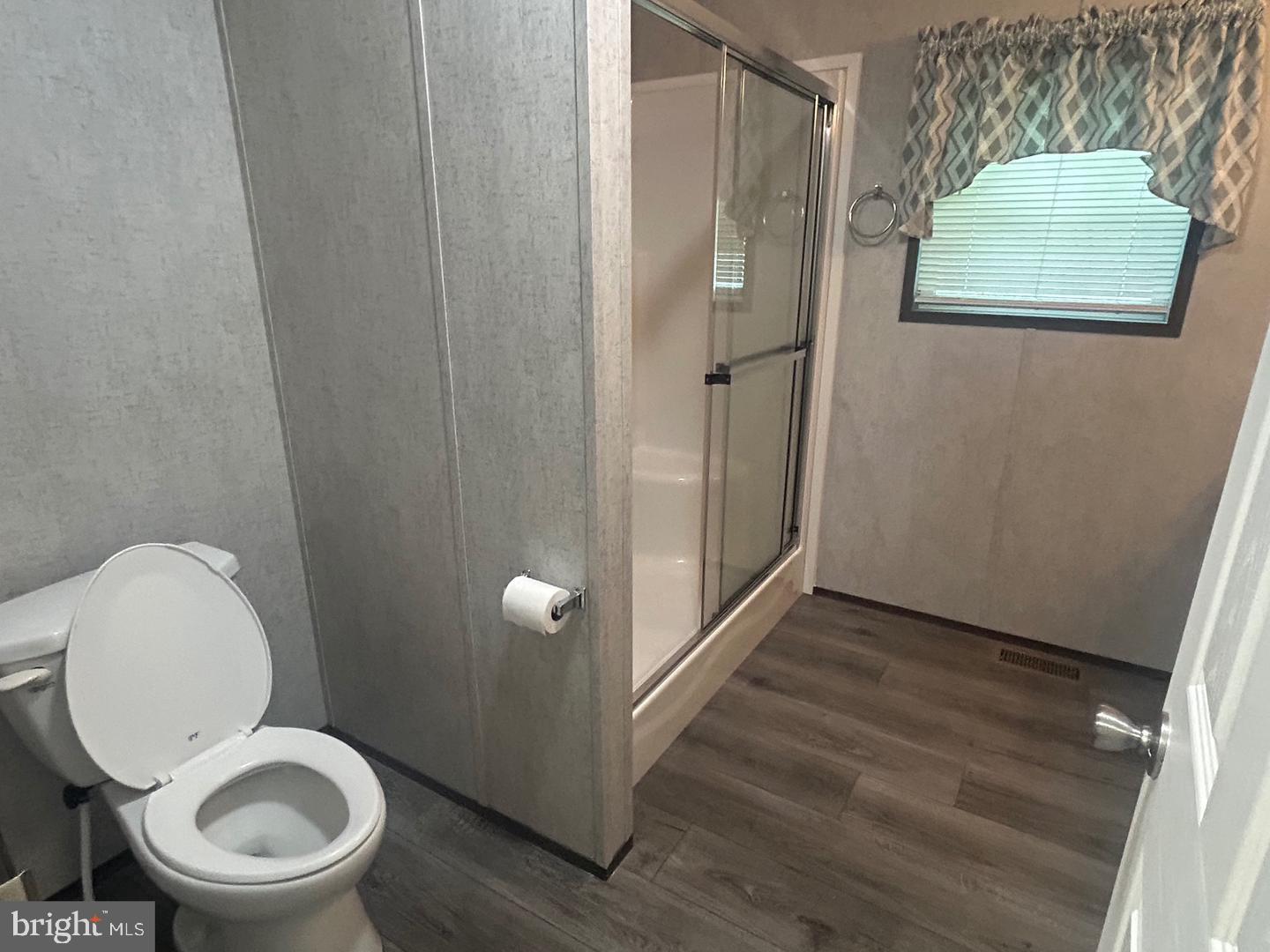 2501 Tilton Road, Unit 323 Egg Harbor Township, NJ 08234 - Photo 9 of 9 a bathroom with a toilet and a shower