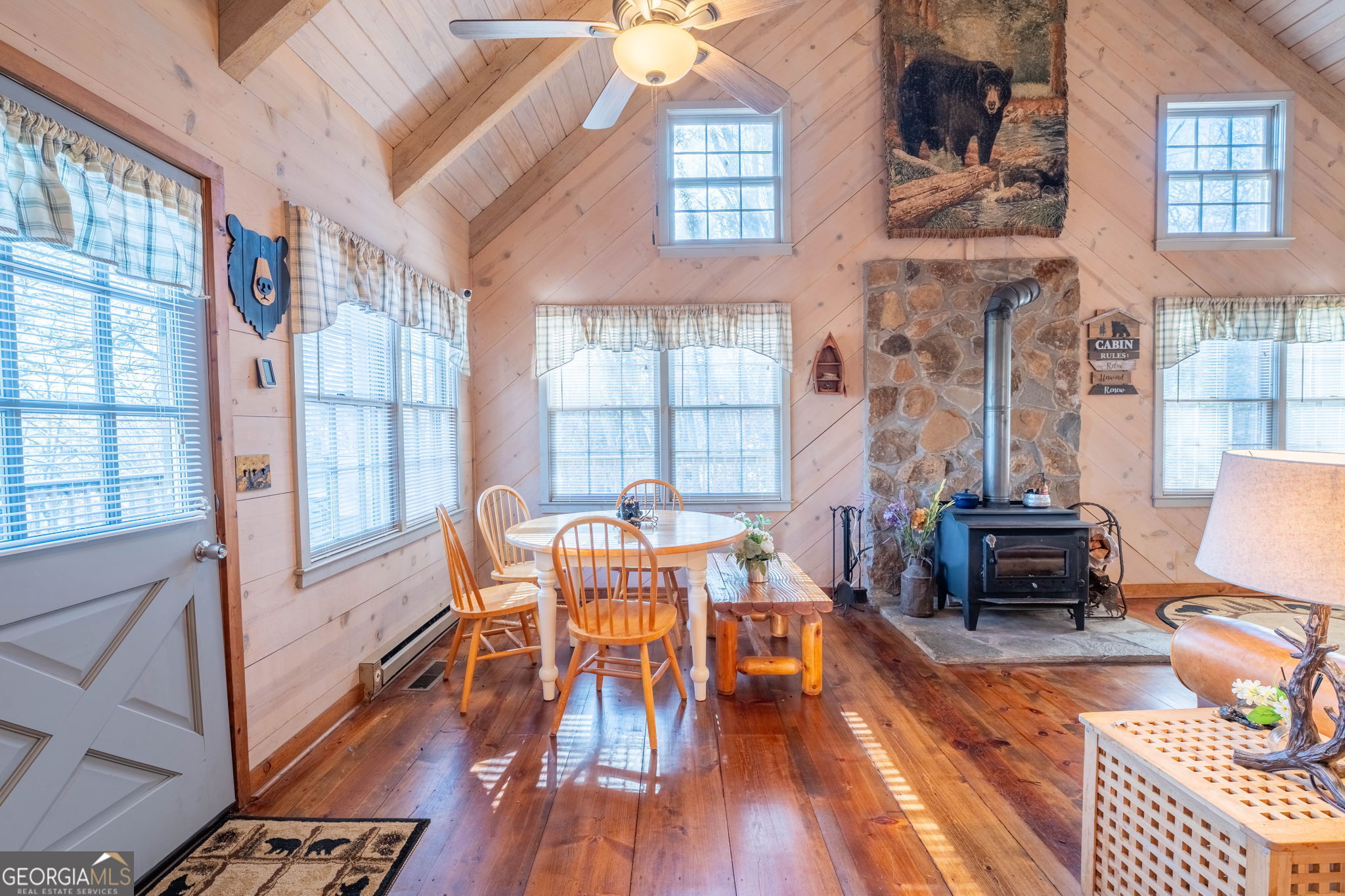 220 McConnell Court Helen, GA 30545 - Photo 15 of 37 a dining room with furniture a chandelier and wooden floor
